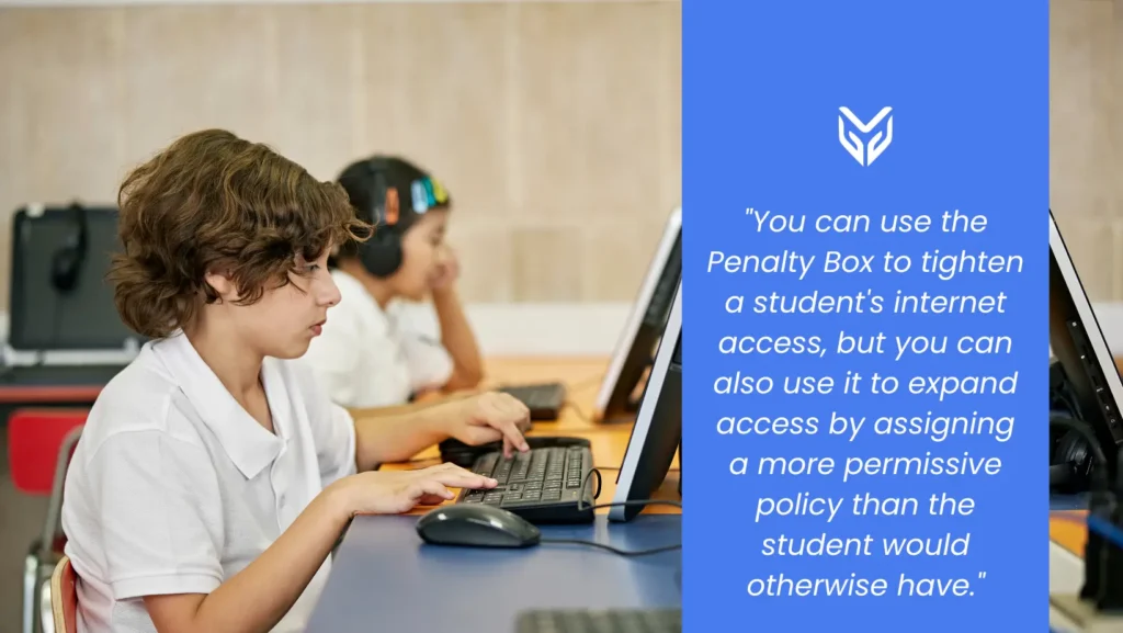 Two students typing on a school computer